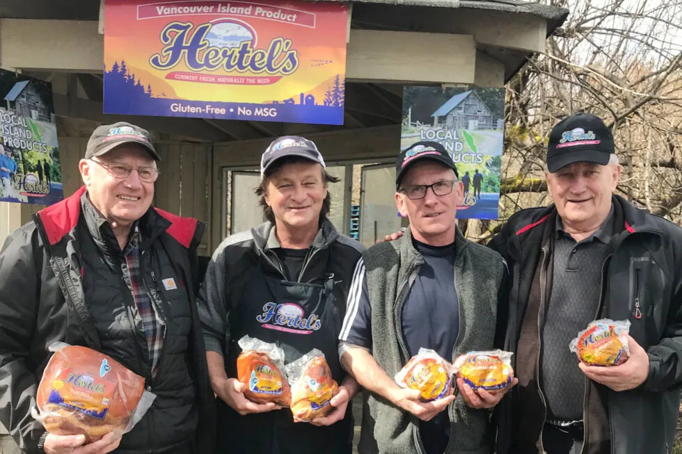 Hertels staff posing with products